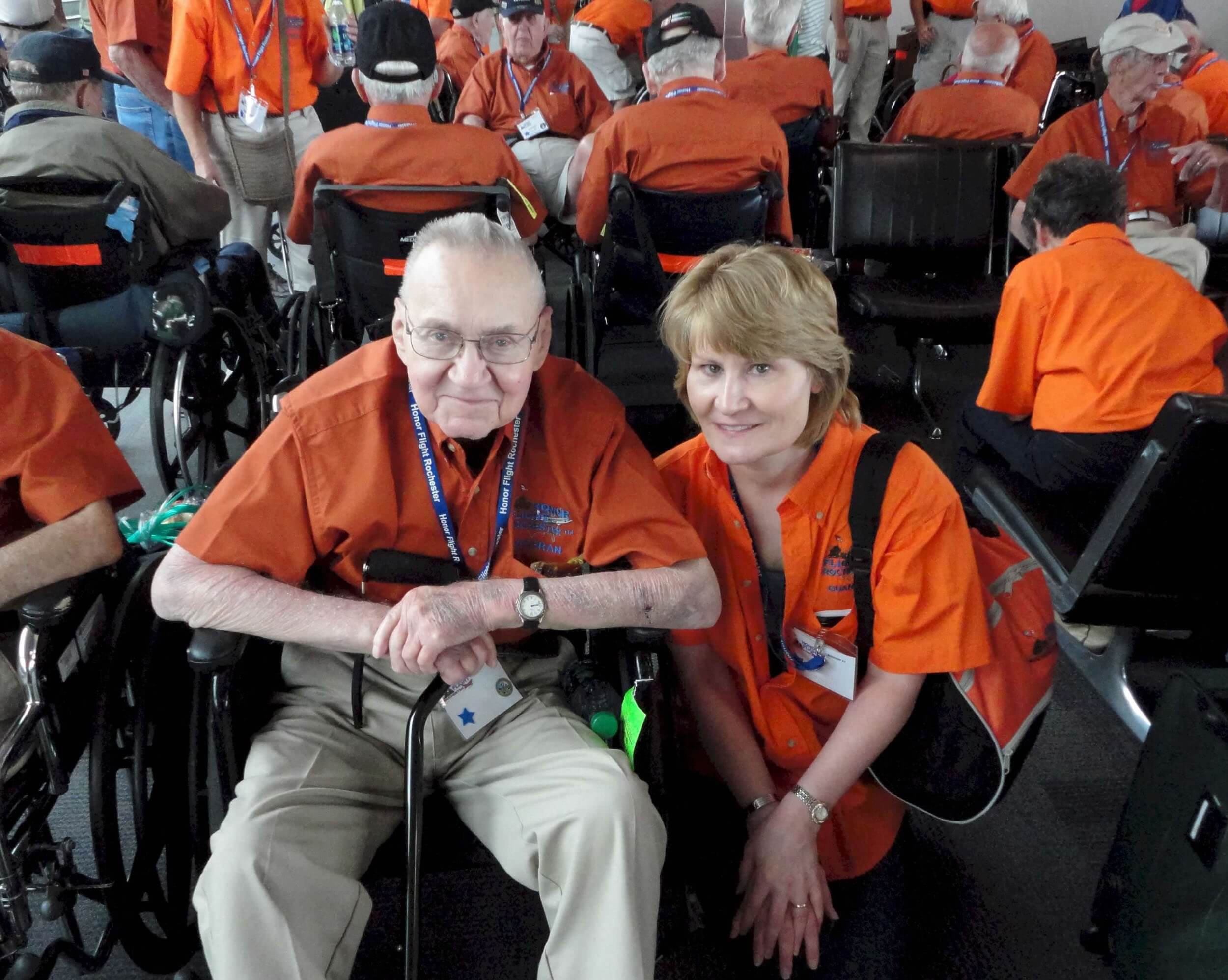 Veteran and guardian sitting in airport